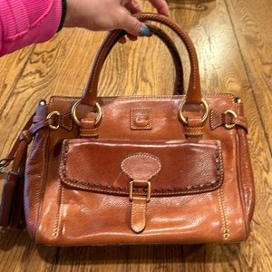 Vintage dooney & Bourne bag tag says “medium pocket satchel” in natural